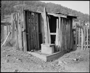 Privies. The privy with some siding is still used. Kentucky Straight Creek Coal Company, Belva Mine, abandoned after... - NARA - 541203 photo