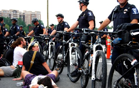 Protesters block an intersection near the Democratic National Convention in Charlotte, North Carolina for several hours while surrounded by police who allow the demonstration to continue, September 4, 2012