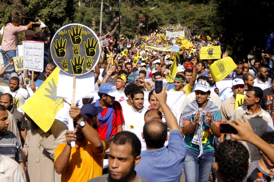 Protesters with R4bia sign in Maadi-Cairo 20-Sep-2013