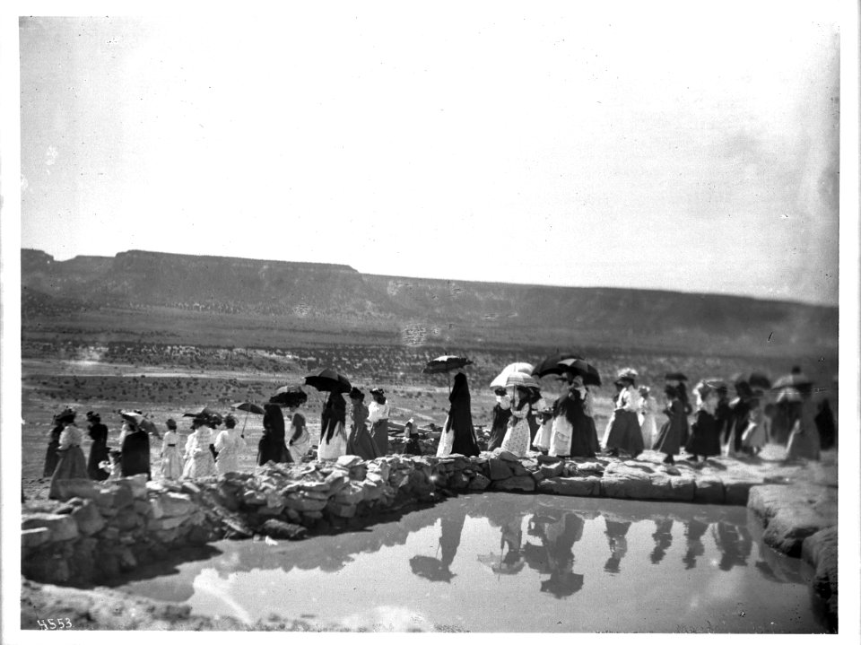 Procession of women next to the reservoir during the Fiesta de San Esteban (Saint Stephen), Acoma Pueblo, New Mexico, 1896 (CHS-4553)