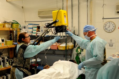 PRT Farah medical team, 541st Forward Surgical Team and coalition medics treat Afghan National Police 121231-N-LR347-087