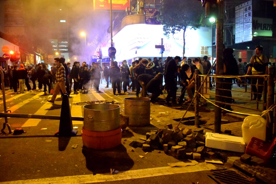 Protesters destroy road bricks under Fishball Revolution 20160209