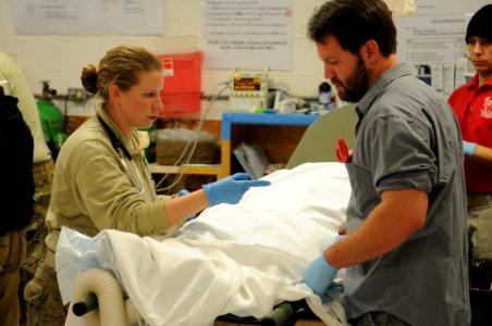 PRT Farah medical team, 541st Forward Surgical Team and Coalition Medics treat Afghan National police 121231-N-LR347-053