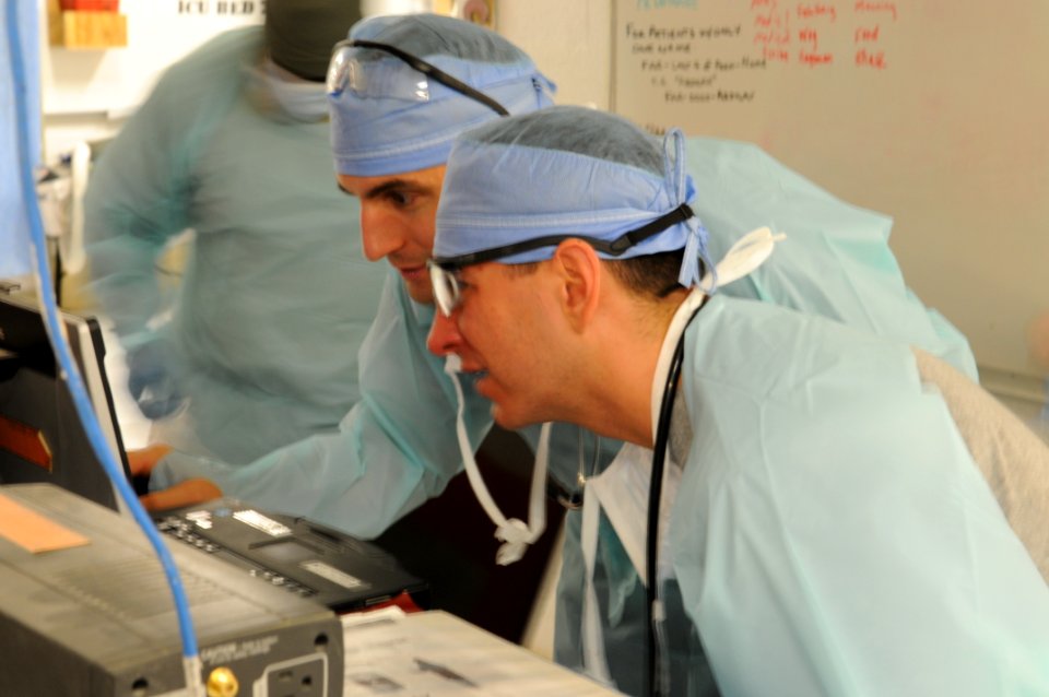PRT Farah medical team, 541st Forward Surgical Team and coalition medics treat Afghan National Police 121231-N-LR347-212