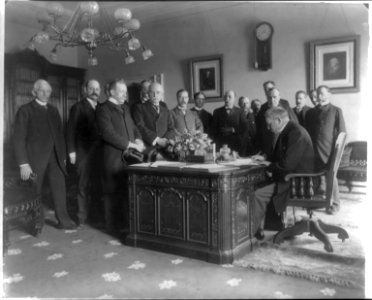 Ratification of the peace treaty with Spain in President's office, White House. McKinley watches as M.Cambon signs. LCCN2016650872