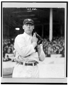 Ray Keating, New York Yankees pitcher, facing front, standing, holding a ball in his glove LCCN2004666451