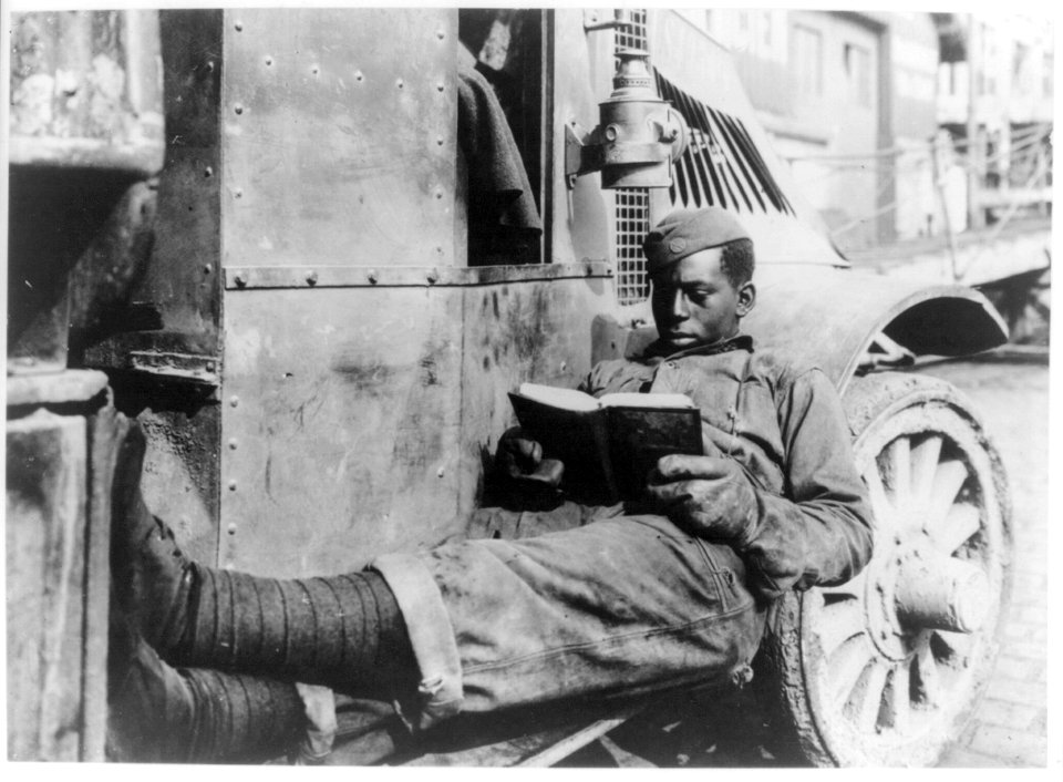 Reading a salvage book by one of the Salvage men on the salvage truck of the A.T.S. salvage office. St. Nazaire LCCN2011660971