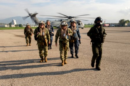 Rear Adm. Roy I. Kitchener, commanding officer of Expeditionary Strike Group TWO, exits a CH-53E Sea Dragon