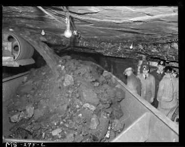 Rear Admiral Joel T. Boone, on inspection trip of Southern Illinois and Indiana mines, watches loading of coal into... - NARA - 540339