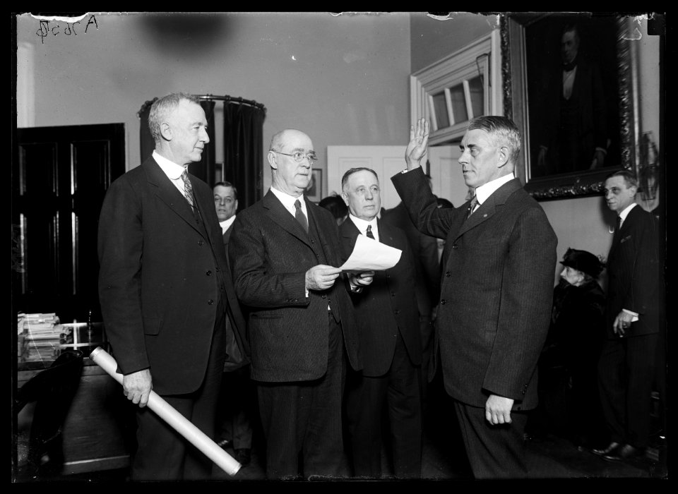 Rear Admiral F.C. Billard, right, being sworn in as new Commandant of U.S. Coast Guard, succeeding Adm. Reynolds, retired LCCN2016887059