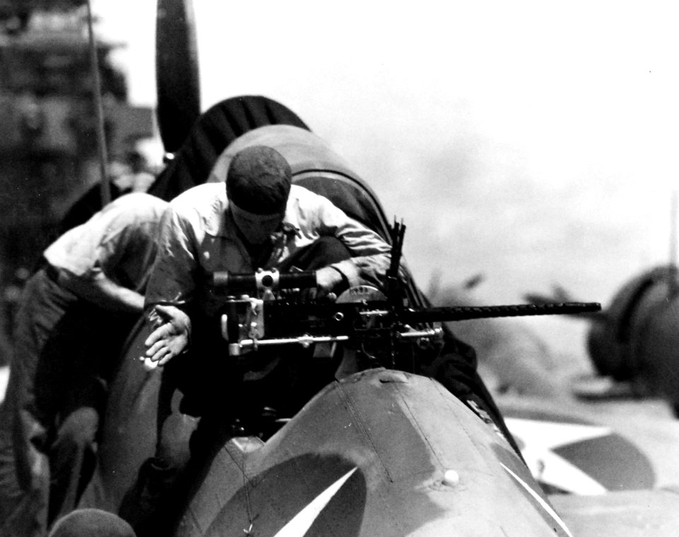 Rear machine gun inspection of a Douglas SBD-3 Dauntless aboard USS Enterprise (CV-6), 10 April 1942 (80-G-16395)