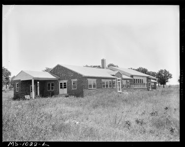 Recreation building in government housing project for miners. This building has not been used. McCurtain, Le Flore... - NARA - 540651
