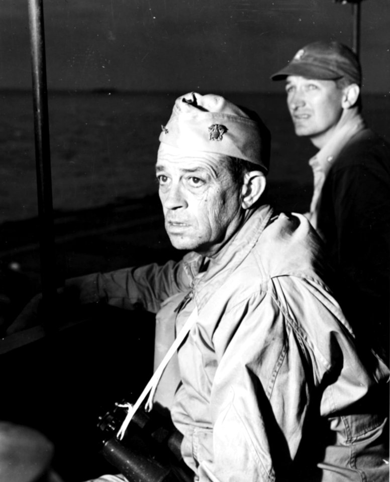 Rear Admiral Clifton Sprague aboard USS Fanshaw Bay (CVE-70), off Okinawa, Japan, in April 1945 (80-G-371327)