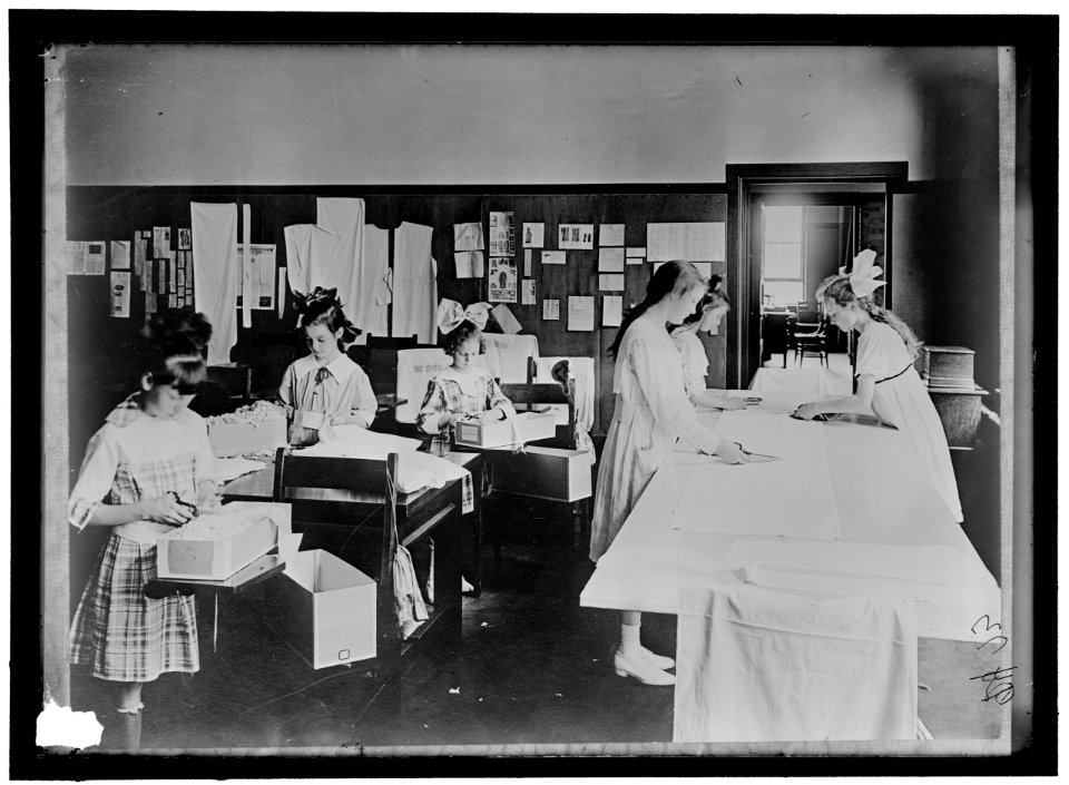 RED CROSS GARMENT DIVISION. MISC. VIEWS OF WORK ROOMS AND WOMEN SEWING, KNITTING, ETC. LCCN2016868399