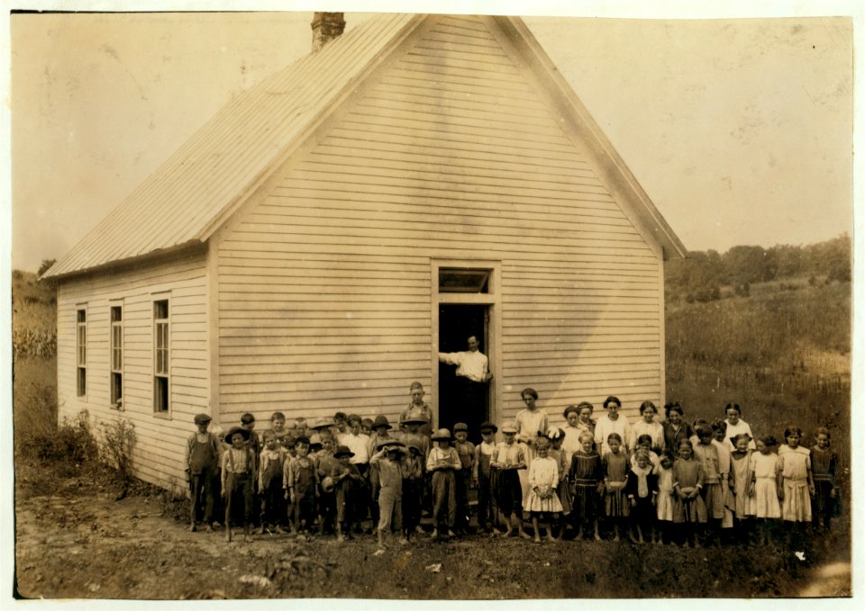 Red Bud School. County Supervisor in doorway. Teacher thought 20 absent on account of work, etc. LOC cph.3b33227