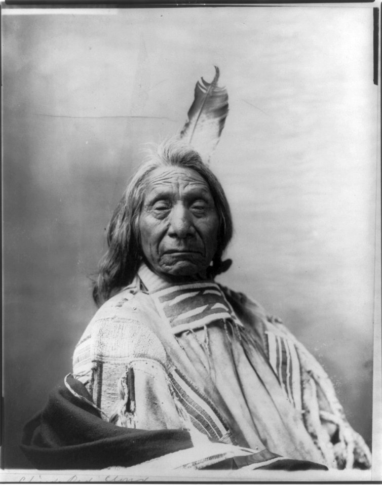 Red Cloud, Chief, head and shoulders portrait, facing slightly right, wearing one feather LCCN2006682633
