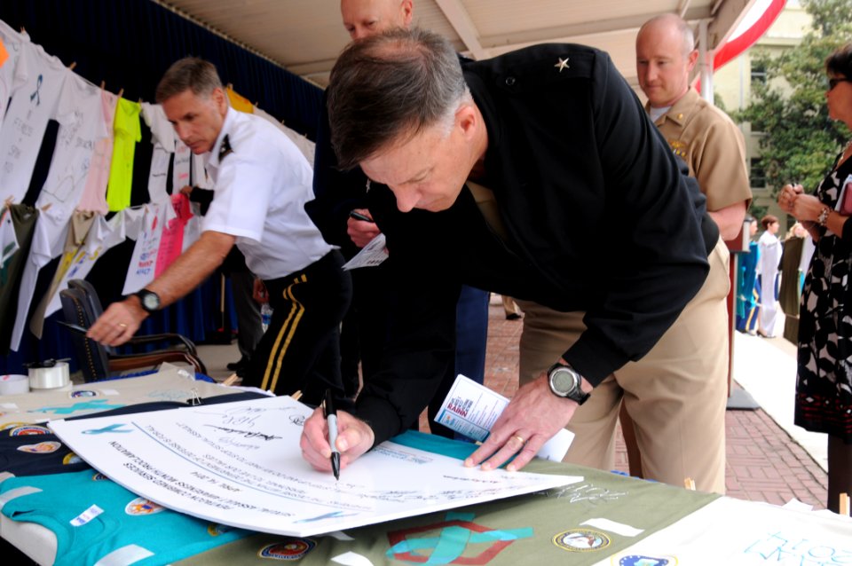 Rear Adm. Sean Buck signs the Pentagon Combined Services sexual assault awareness month proclamation. (13878748903)