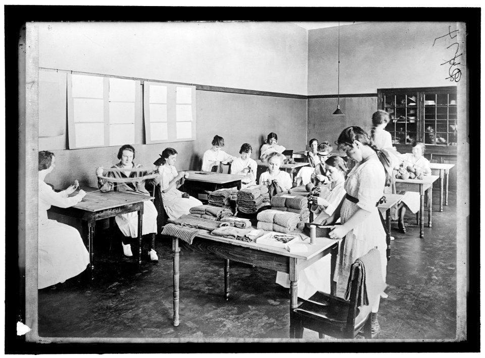 RED CROSS GARMENT DIVISION. MISC. VIEWS OF WORK ROOMS AND WOMEN SEWING, KNITTING, ETC. LCCN2016868400