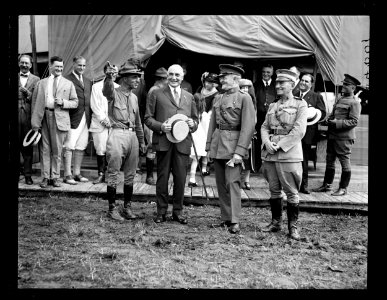 Reenactment of Pickett's Charge at the battle of Gettysburg in Pennsylvania. Smedley Butler, President Warren Harding, John J. Pershing, and John Archer Lejeune in front of canvas White LCCN2016891536