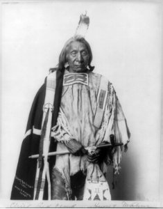 Red Cloud, Chief, three-quarters length portrait, standing, facing slightly right, holding pipe LCCN2006682632 photo