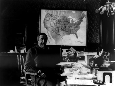 Redfield Proctor, 1831-1908, three-quarter length portrait, seated at desk, facing right