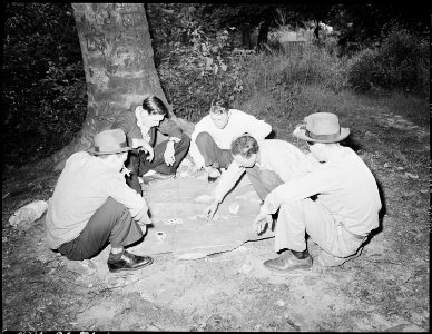 Regular Sunday pasttime among these miners is playing poker and shooting craps down by the river bank. P V & K Coal... - NARA - 541339