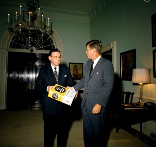 Representative Edward Boland (Massachusetts) Presents Webster's International Dictionary to President John F. Kennedy