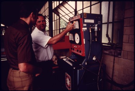Relieved Motorist Sees an Employee of an Auto Emission Inspection Station in Downtown Cincinnati, Ohio...09-1975 (4265795499)