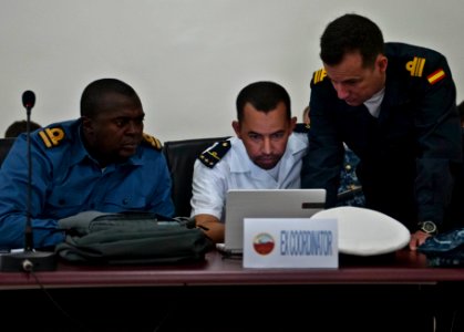 Republic of Sierra Leone Armed Forces Lt. Mark Sumah; Mauritanian Navy Lt. Ahmed Salem Maouloud, the coordinator for Saharan Express 2014; and Spanish Navy Lt. Cmdr. Antonio de Ugarte Blanco work together 140310-N-QY759-054