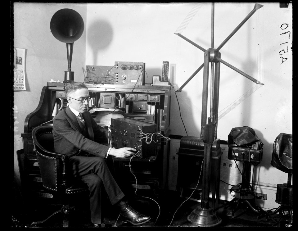 Rep. Vincent M. Brennan, of Mich., listening in at his office to the debates of floor of House. Mr. Brennan has introduced resolution providing for broadcasting to the country of the LCCN2016891932
