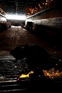 Repairing a ramp aboard the USS Kearsarge DVIDS128829