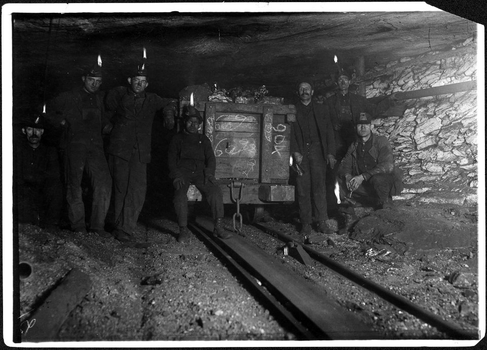 Resting with load at the head of the slope. Small boy is Jo Puma, a nipper. Jo's mother showed me the passport which... - NARA - 523376