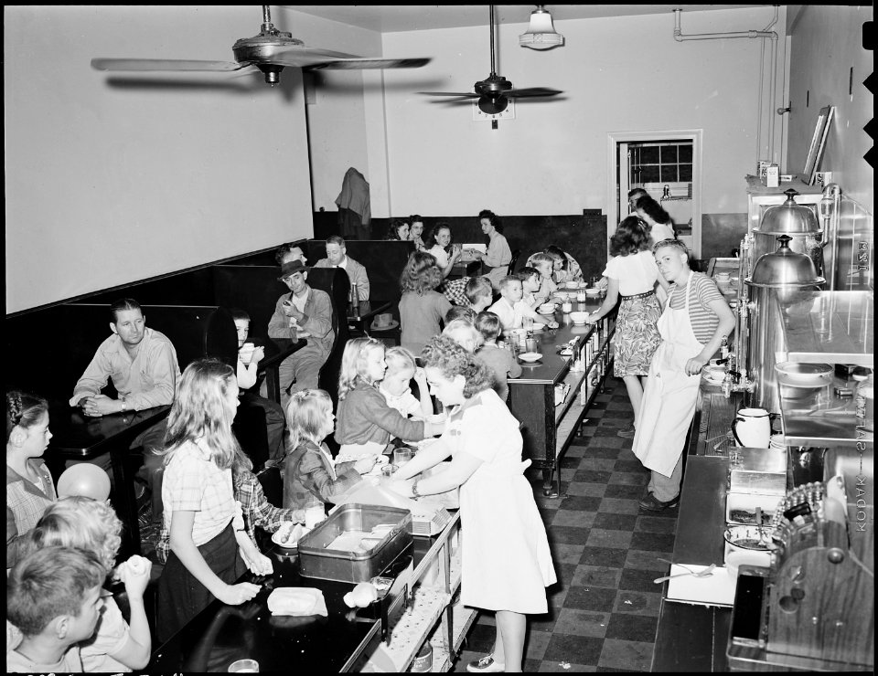 Restaurant in community coal building is operated as a private concession, is largley patronized by children at lunch... - NARA - 541462