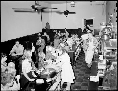 Restaurant in community coal building is operated as a private concession, is largley patronized by children at lunch... - NARA - 541462