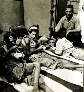 Rescued merchantmen on U.S. Navy patrol boat after 83 days on raft, March 1943 (24632469322)