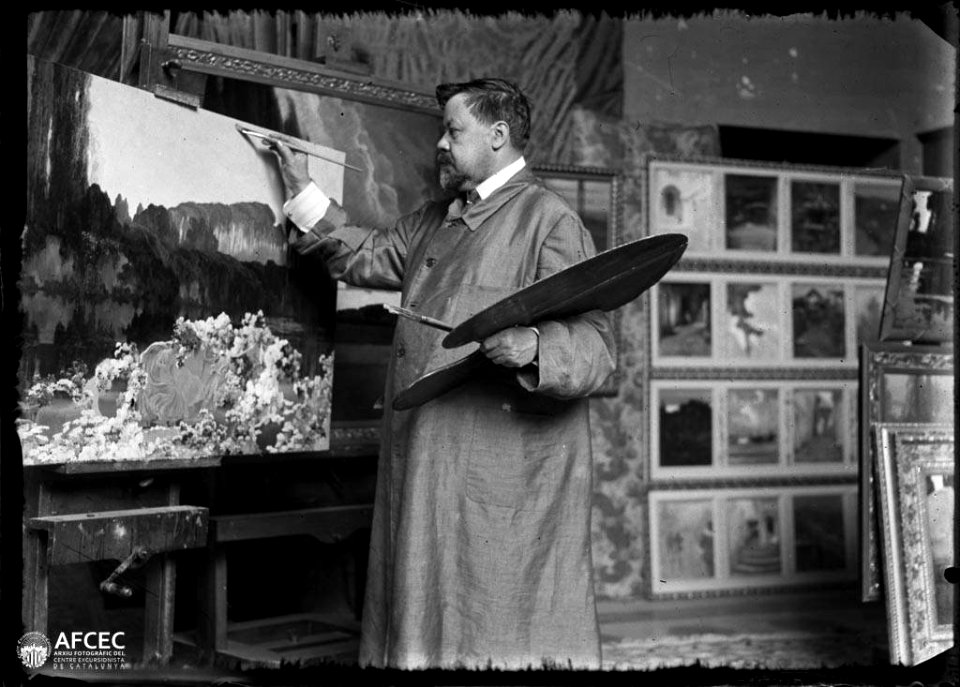 Retrat del pintor Enric Serra Auqué pintant al seu estudi