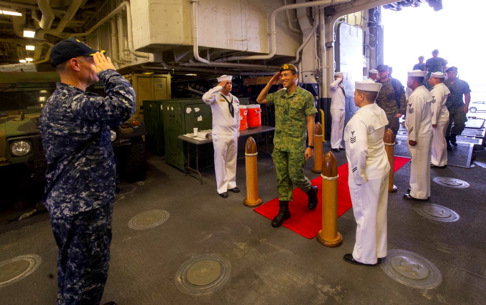 Republic of Singapore Brig. Gen Mark Tan Ken-Li, commander of the Republic of Singapore Army 21 Division, arrives aboard the amphibious assault ship USS America (LHA 6) during a scheduled ship visit 170808-N-ZS023-074