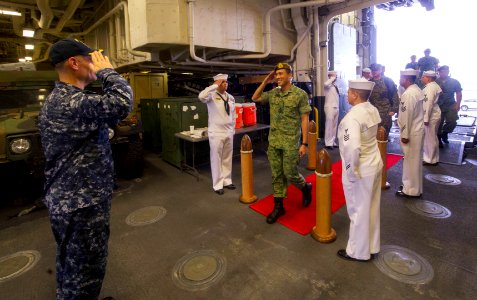 Republic of Singapore Brig. Gen Mark Tan Ken-Li, commander of the Republic of Singapore Army 21 Division, arrives aboard the amphibious assault ship USS America (LHA 6) during a scheduled ship visit 170808-N-ZS023-074