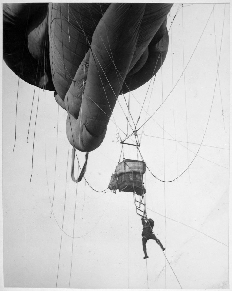 Returning from a U-Boat scouting party. Aerial naval observer coming down from a Blimp type balloon after a... - NARA - 533474