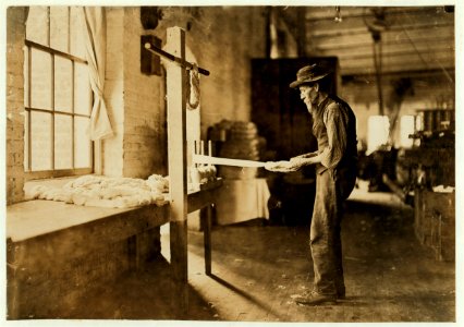 Rhodes Mfg. Company, Lincolnton, N.C. Old man inspecting yarn. Been in cotton mills over 20 years. LOC nclc.01399