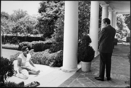 Richard M. Nixon talking to a carpenter laying the sub-carpet for Tricia Nixon's wedding. - NARA - 194724 photo