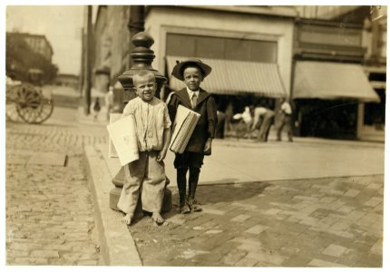Richard Green, (with hat), 5 year old newsie, Richmond, Va. Willie--, who said he was 8. (Compare them.) Many of these little newsboys here. LOC nclc.03726