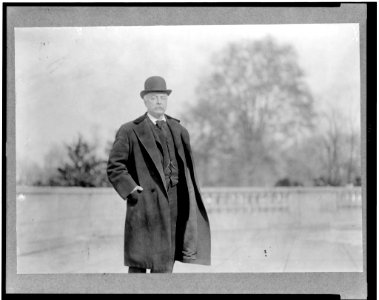 Richard Wayne Parker, three-quarter length portrait, standing, facing slightly right, wearing overcoat and hat LCCN94507648