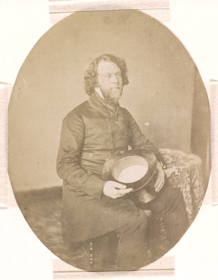 Richard Vaux, three-quarter length studio portrait, seated, facing right, holding a top hat in his lap, with left elbow resting on a table LCCN2015651554