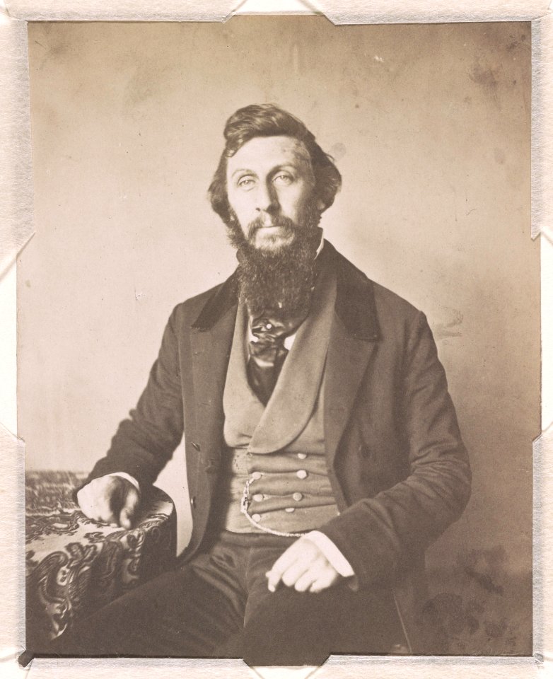 Frederick De Bourg Richards, three-quarter length studio portrait, seated with right hand resting on a table, facing front LCCN2015651559
