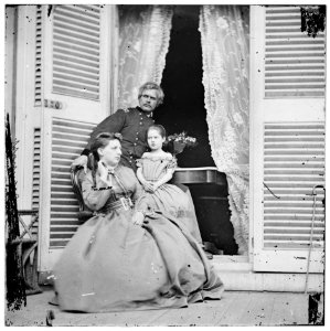Richmond, Virginia. Gen. Edward O.C. Ord, wife and child at the residence of Jefferson Davis. In the doorway is the table on which the surrender of Gen. Robert E. Lee was signed LOC cwpb.02927
