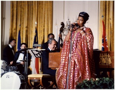 Richard M. Nixon playing piano at the White House while Pearl Bailey sings - NARA - 194571 photo