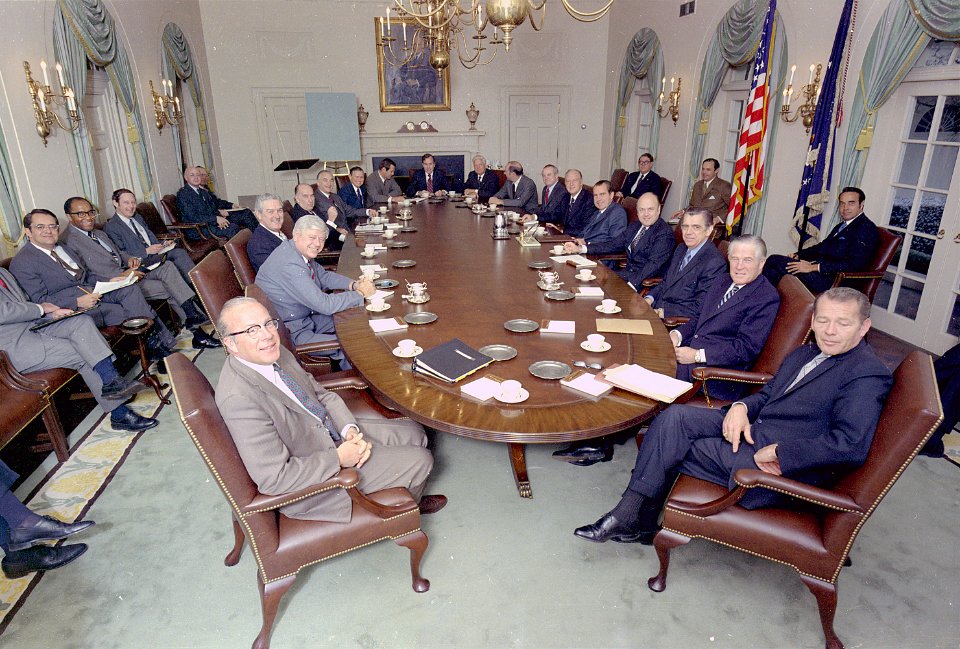 Richard M. Nixon posing with his cabinet in the cabinet room in the white house. - NARA - 194353 photo