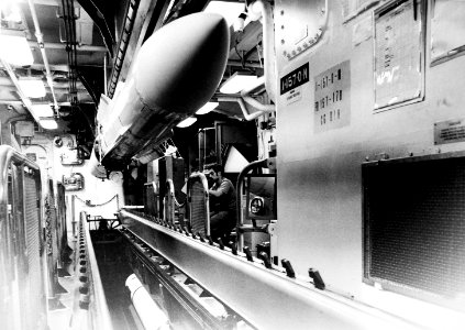RIM-67 Standard missiles are loaded on the missile house rail aboard USS Mahan (DDG-42) on 1 March 1983 (6370831)