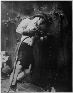 Riveter at work at Hog Island Shipyard. Pennsylvania, 1918. Kadel & Herbert., 1917 - 1919 - NARA - 533745 photo